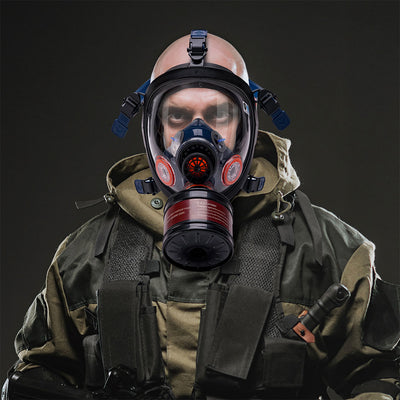 Person wearing a gas mask and military uniform on a black background