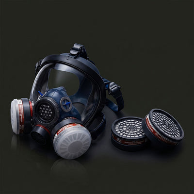 Full-face gas mask with filter cartridges on a dark background